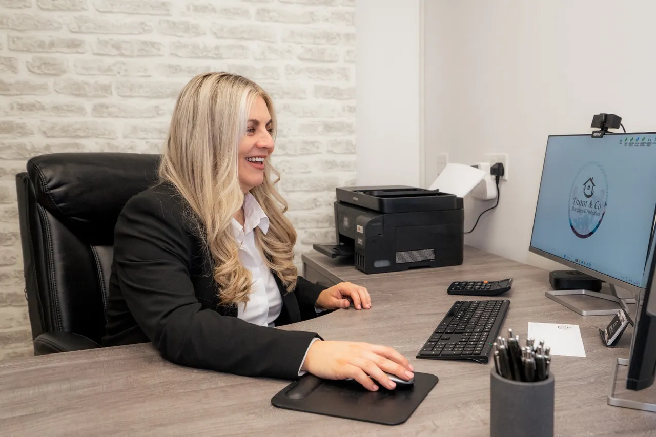 Eleanora at her desk in the Dunn & Co Rathfriland office.
